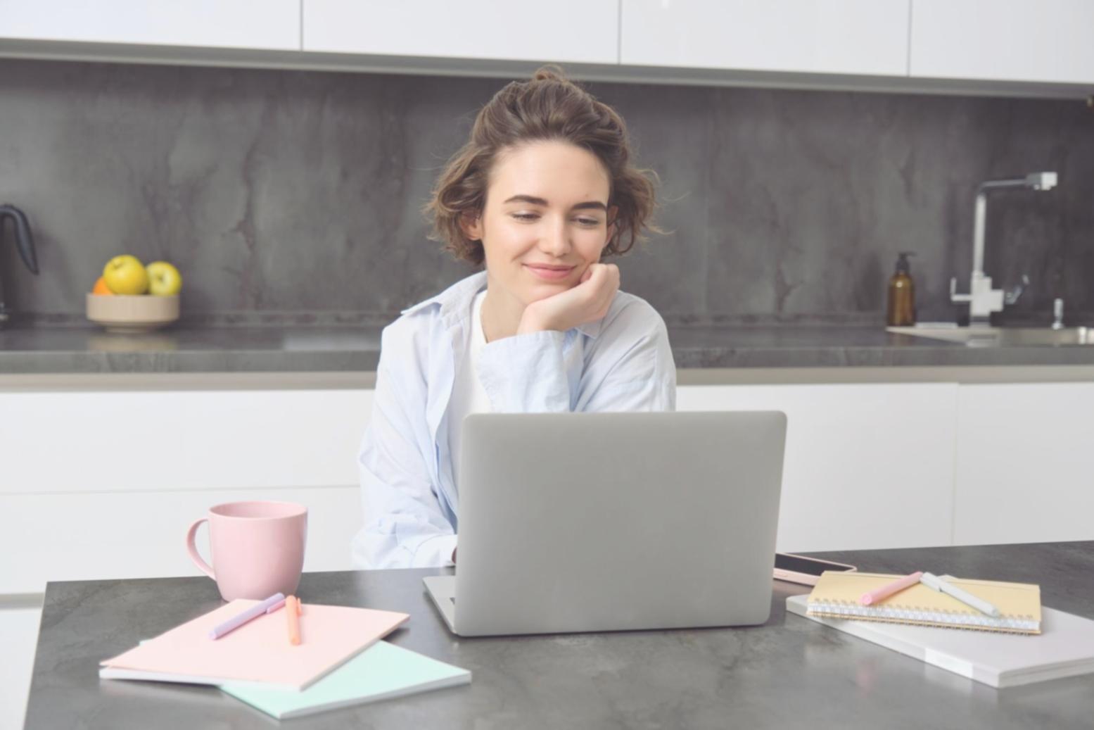 Person reviewing financial documents with focused concentration